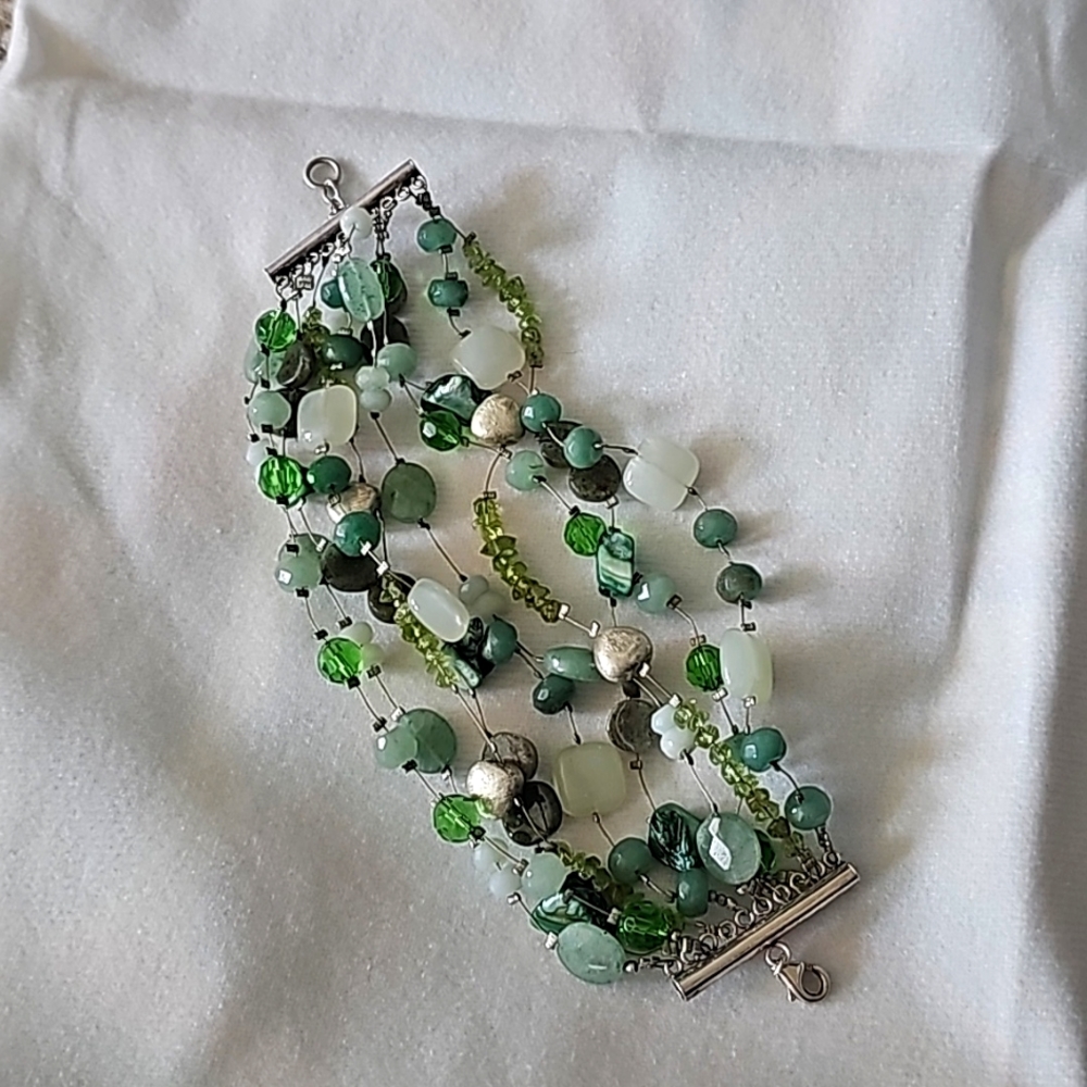 Multiple bead bracelet with silver endpiece and closure.